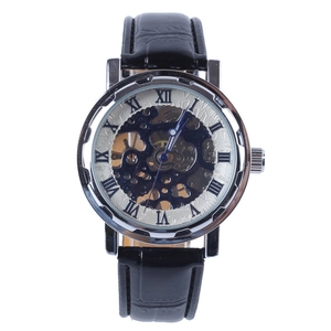 Macro detail of men's mechanical watch with hollow dial and Roman numeral markers