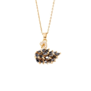 Elegant gold necklace with a black swan pendant featuring pavé-set crystals on white background