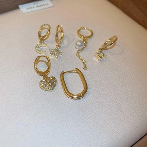 Elegant 6-piece gold plated earring set featuring stars, moons, and imitation pearls