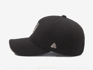 Detailed side view of a black cotton baseball cap with golden triangular embroidery