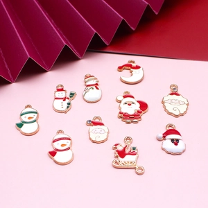 Collection of colorful Christmas enamel charms featuring Santa and snowmen for DIY jewelry