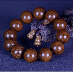 Macro detail of natural Wutai Mountain Liudaomu prayer beads with distinct wood grain
