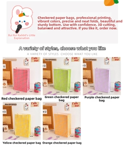 Detail of colorful plaid checkered kraft paper gift bags in various vibrant colors