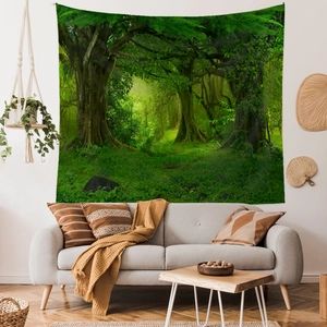 Lush forest landscape tapestry hung over a modern sofa in a cozy interior setting