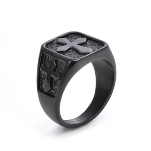 Macro shot of black signet ring for men featuring cross pattern and matte texture