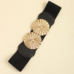 Detail of black elastic waist belt featuring a gold circular double buckle closure
