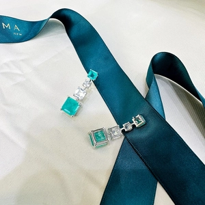 Elegant emerald green square drop earrings in 925 sterling silver with sparkling white diamonds