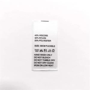 Close-up of knit beanie care label showing 58cm size and material washing instructions