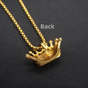 Macro back view of gold crown pendant showing detailed craftsmanship and beaded chain