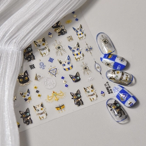 Detail of Egyptian cat nail stickers with gold foil finish and applied nail tips