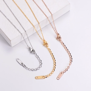 Detail of 18KGP lobster clasp and engraved steel tags in gold silver and rose gold finishes