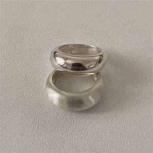 Minimalist 925 sterling silver ring set featuring polished and brushed metal textures