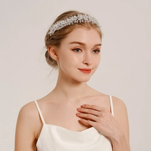 Detail of silver bridal headband with crystal leaves and beads for wedding accessories