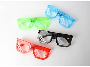Detail view of four LED mosaic pixel sunglasses in blue, green, black and red colors