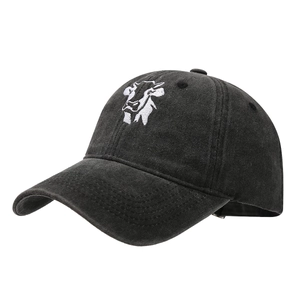 Distressed black cotton baseball cap with white cow head embroidery and washed vintage texture