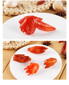 Macro detail of realistic roasted chicken wing and claw food model with glossy texture