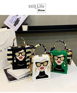 Three elegant box clutch bags with fashion graffiti and silk wrap handles in a group shot
