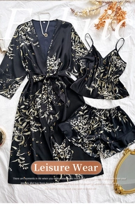 Flat lay of floral satin three-piece loungewear set including robe, cami and shorts