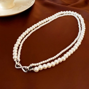 Double-layer white pearl necklace with gold-plated crown zircon clasp on brown silk