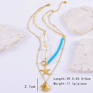 Macro view of ocean-style layered necklace with starfish, shell pendants and blue beads