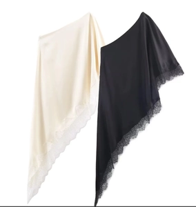 Detail of asymmetrical lace trim and satin fabric texture on casual women tops