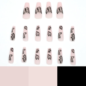 Long ballet press-on nails in nude pink featuring elegant black butterfly wing patterns