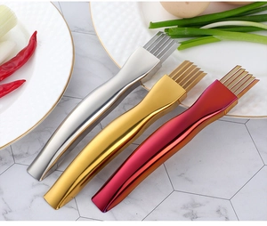 Detailed close-up of golden and silver stainless steel scallion shredders on a table