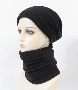 Close-up of black ribbed knit beanie and neck warmer set showing thick texture