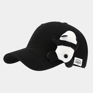 Close-up of black cotton baseball cap featuring a cute 3D plush panda and side patch