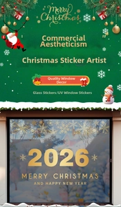Close-up of gold 2026 Christmas UV window stickers with snowflakes and festive greetings