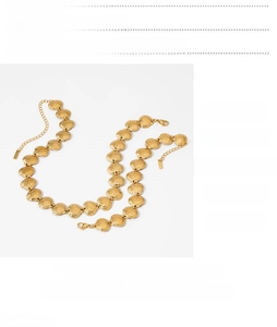 Macro view of gold seashell necklace with PVD plating and technical specifications