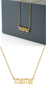 Detail of a gold stainless steel necklace featuring a cursive mama letter pendant on a box