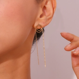 Detail of 18K gold-plated stainless steel earrings with long snake chain tassels on model