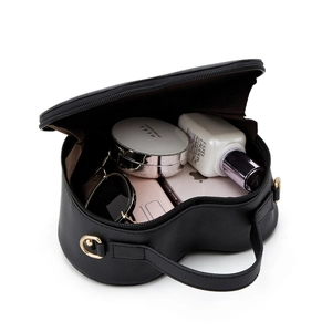 Macro view of heart-shaped Saffiano leather bag interior showing daily storage capacity