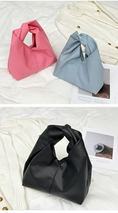 Detailed view of cloud-shaped hobo bags with pleated knots in pink, blue, and black