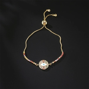 Detailed view of evil eye bracelet with colorful zircons and adjustable gold sliding clasp