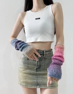 Detail of colorful rainbow gradient wool knit sleeve warmers with soft texture