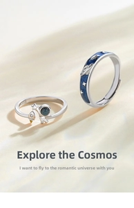 Close-up of S925 silver astronaut couple rings with blue starry glaze and zircons