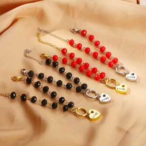 Bracciali con perline e ciondolo a cuore inciso LOVE in finiture oro e argento