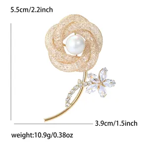 Elegant gold hollow rose brooch with rhinestones and pearl detail for formal wear