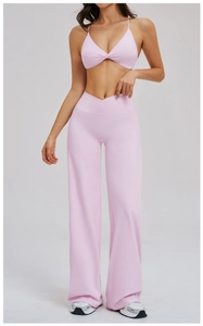 Pink brushed yoga set featuring cross-waist wide leg pants and twist sports bra