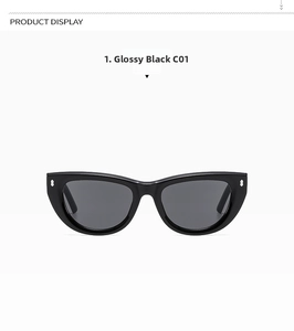 Dettaglio occhiali da sole cat-eye nero lucido con rivetti argento e lenti grigie