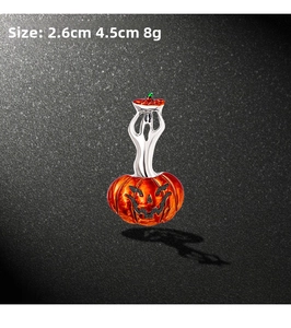 Detail view of Halloween ghost and pumpkin brooch with 2.6cm by 4.5cm size indicators