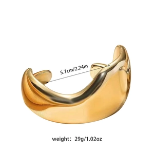 Detailed view of polished gold CCB cuff bracelet with 5.7cm inner diameter and 29g weight