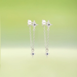 Detailed view of S925 sterling silver star fringe earrings with dark blue gemstone