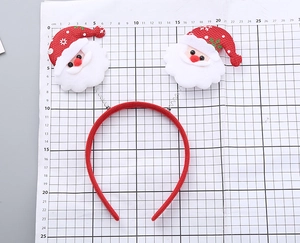 Detailed size measurement of Santa Claus spring headband on a professional grid mat