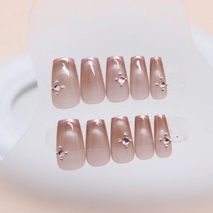 French cat-eye press-on nails with pink rhinestones and gradient coffin shape