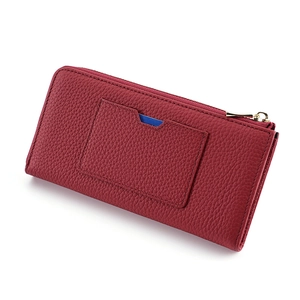 Red pebbled leather long wallet with RFID protection and gold zipper on white background