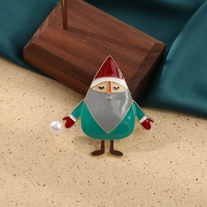 Detail of Santa Claus brooch with enamel oil drip finish and white pearl accent