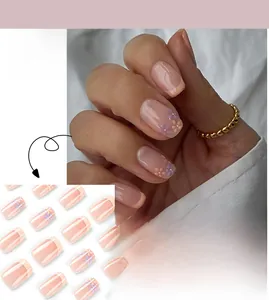 Short press-on nails featuring yellow French tips and purple floral patterns